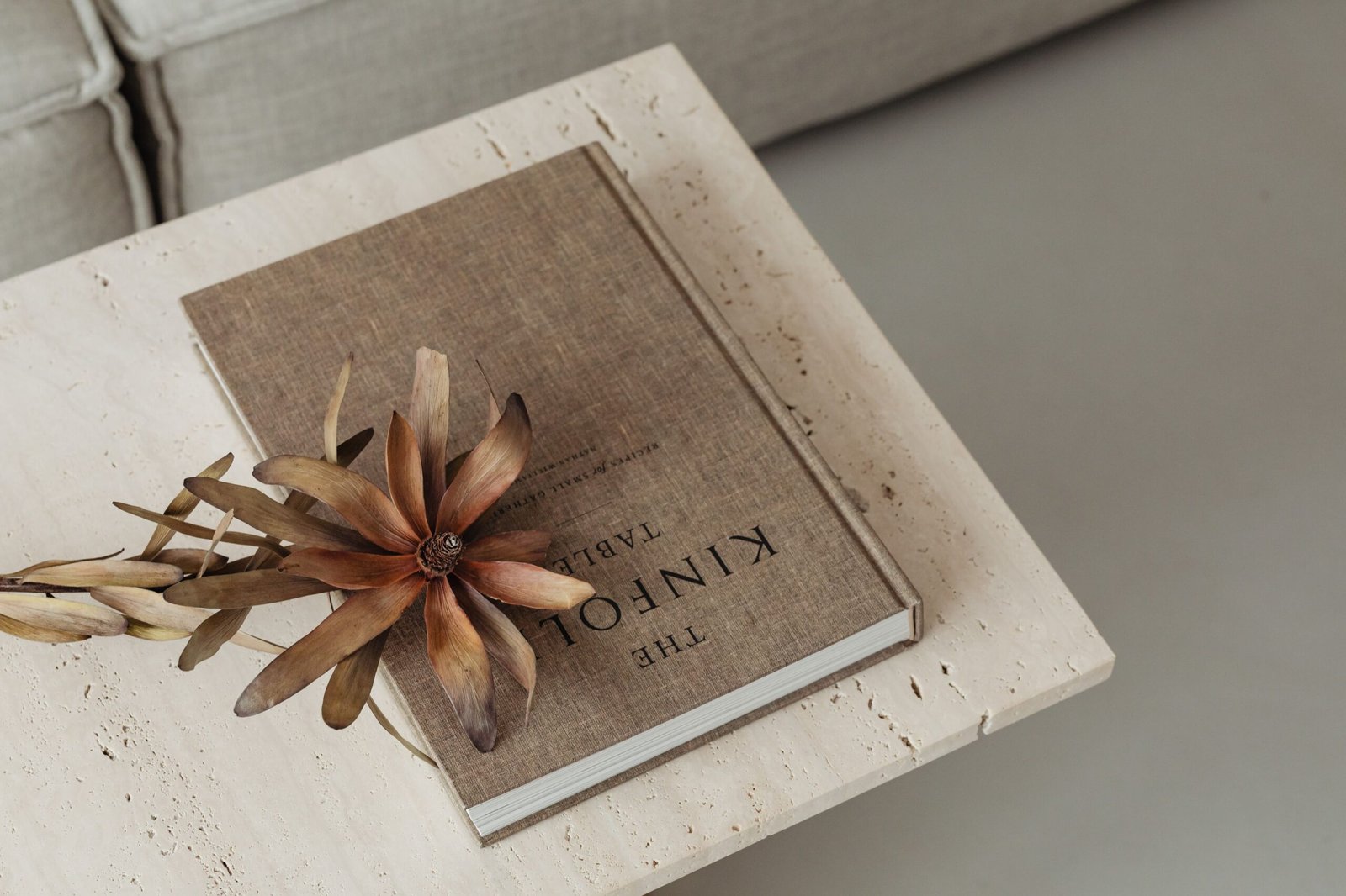 kaboompics_the-book-lies-on-a-travertine-table-kinfolk-dried-flower-27371